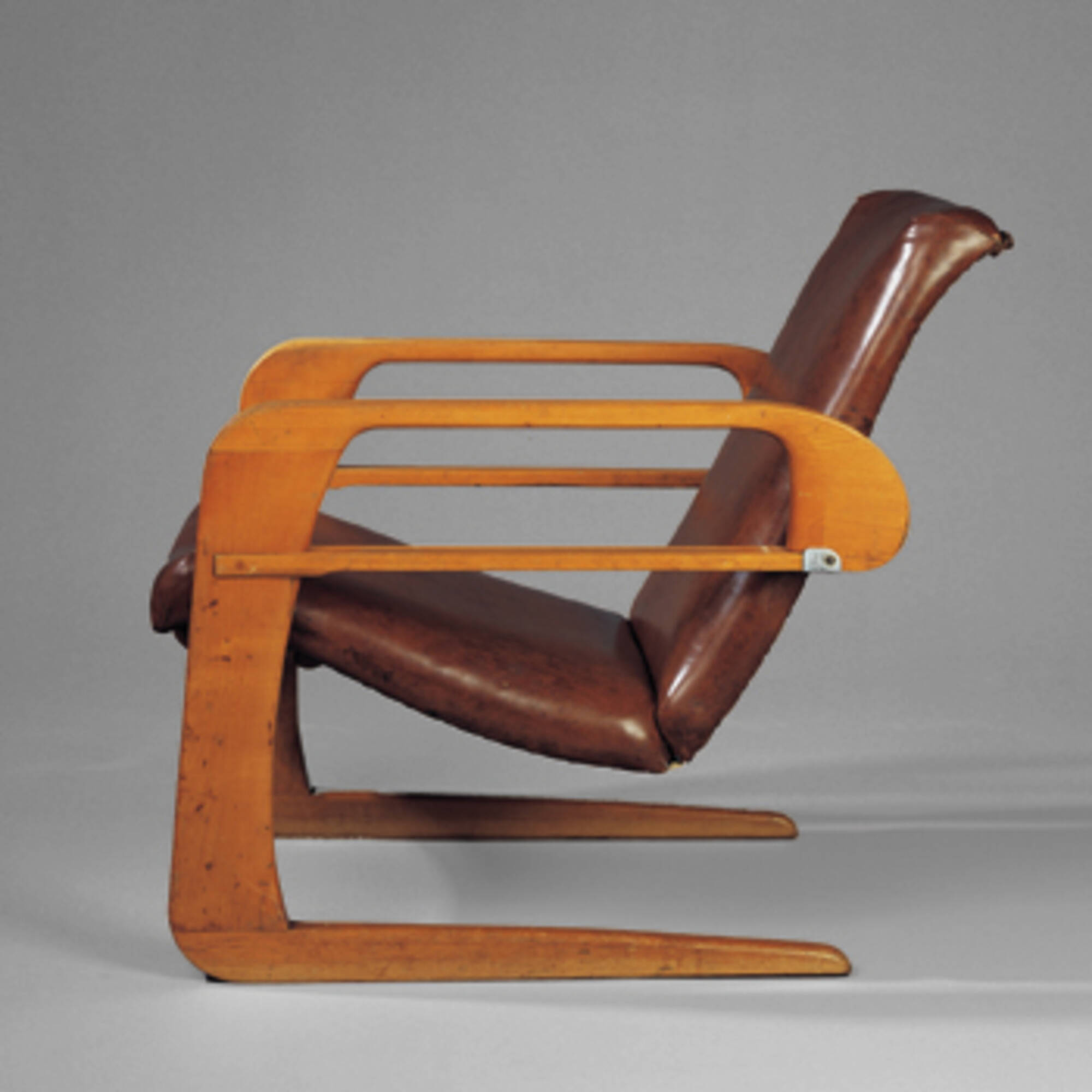 Original Kem Weber Airline armchair in dark leather